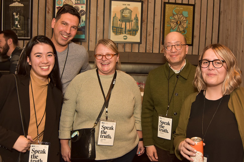 A group of five people smiling at the camera at DesignThinkers 2018.