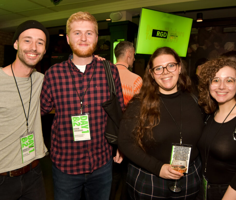 A group of four people at the delegate party. Olivia is on the far right.