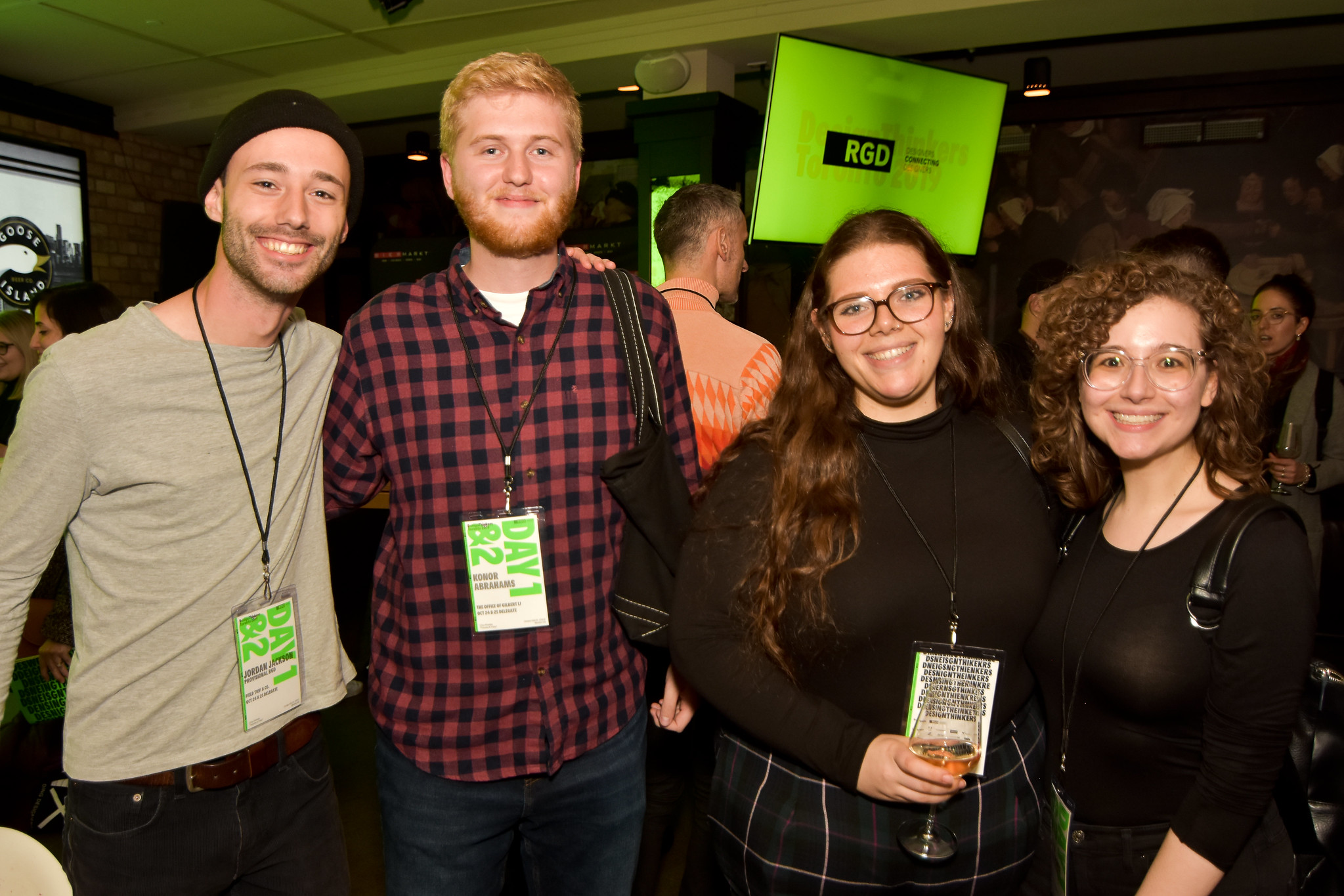 A group of four people at the delegate party. Olivia is on the far right.